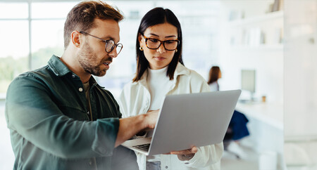 A man and a woman talk about investments.