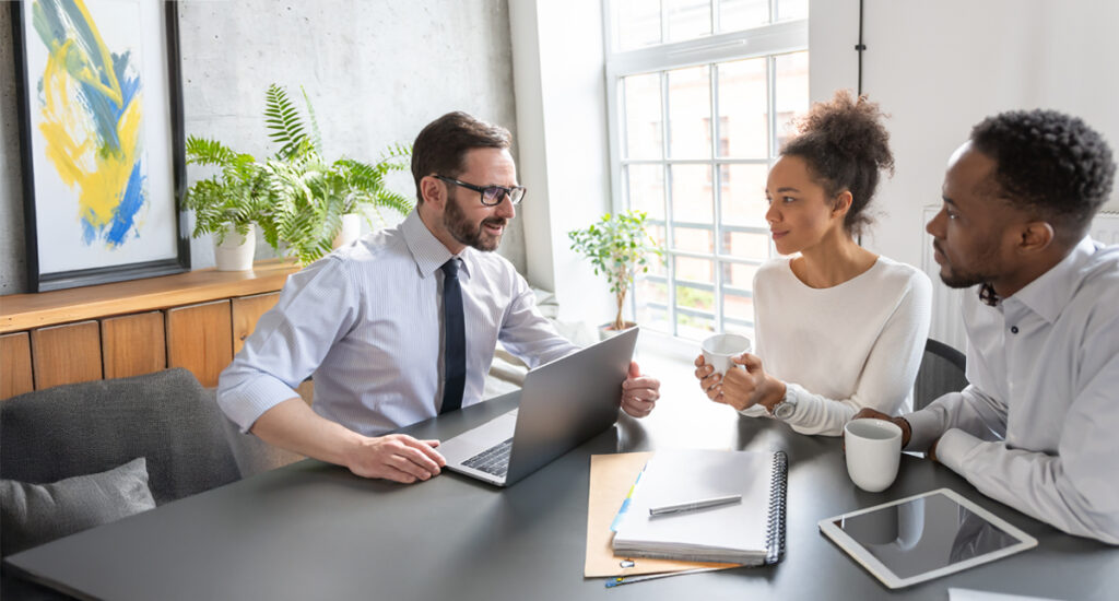 Image of a banker talking to clients