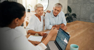 An older couple meeting with their trust advisor.