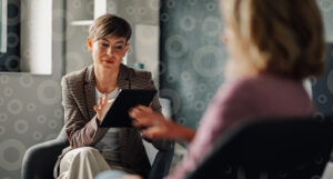 Professional looking over trust accounting software on a tablet.