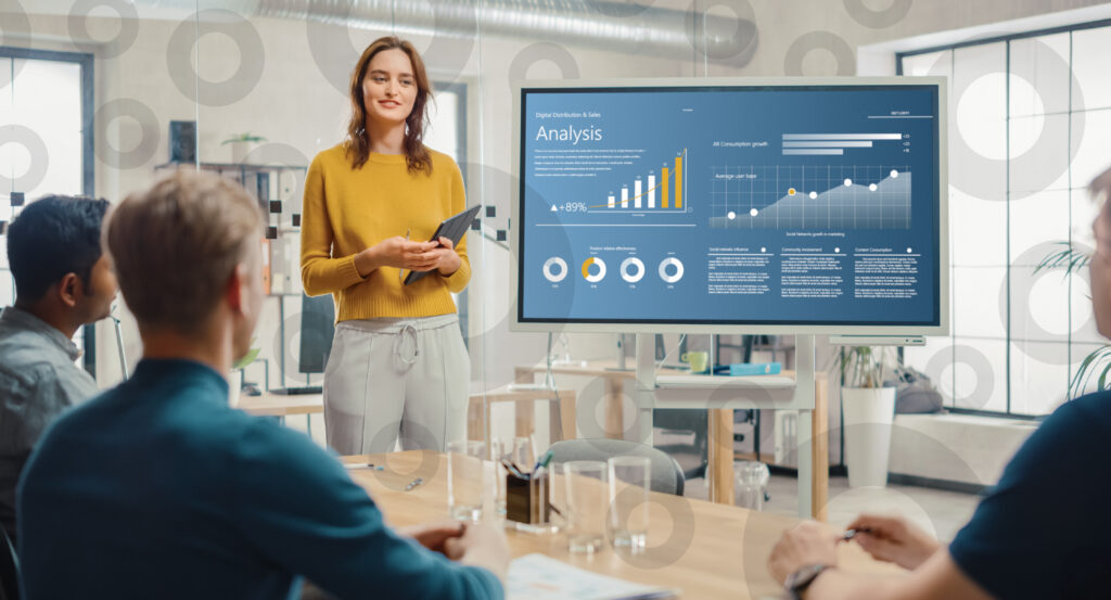Business professional explaining trust account software in a meeting with other professionals